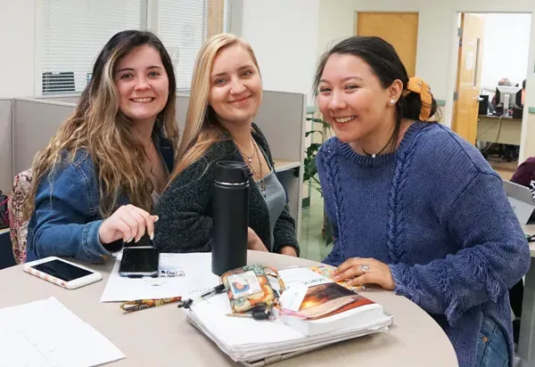 three female students in the student lounge